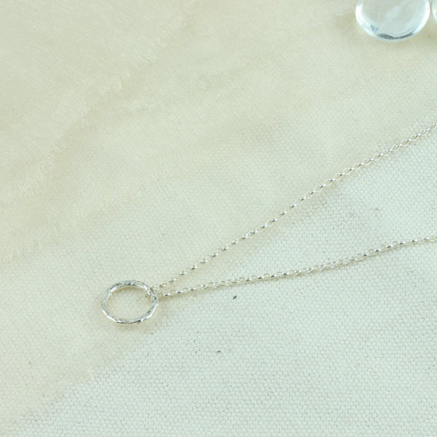 Eco silver hoop shiny pendant necklace with a hammered texture making the hoop sparkle.
