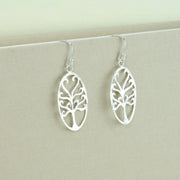 Eco silver earrings with a unique Tree of life design in an oval frame. The braches have a round finish and the two at the top form a heart shape. These earrings have a hammered texture and mirror finish.