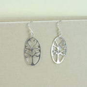 Eco silver earrings with a unique Tree of life design in an oval frame. The braches have a round finish and the two at the top form a heart shape. These earrings have a hammered texture and mirror finish.