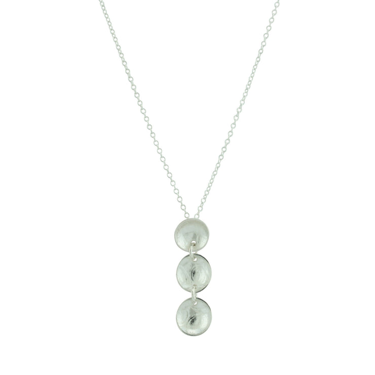 Silver sups pendant necklace featuring three silver domed cups attached to each other by jump rings to form a vertical pendant. The three cups feature a pebble or stripe texture and have a mirror finish.