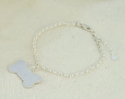 Silver personalised dog bone charm bracelet The dog bone is approximately 2.5 x 1.3cm in size and can be personalised with a word, initials, letter or symbols. This charm is also available as a pendant necklace. The briolette gemstones is attached to the same jump ring as the pendant, so they sit together. The necklace can be fastened at three different lengths at 40cm, 45cm and 50cm.