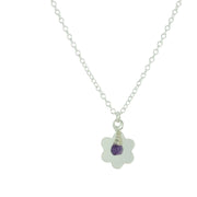 Silver personalised pendant necklace with a flower pendant that can be personalised with a word, name, initials or symbols of your choosing. The pendant can be fastened at various lengths. The pendant is made using eco silver. This version shows the pendant necklace with the addition of an Amethyst gemstone, more gemstones are available too.