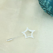 A silver pin featuring a star. The star is open on the inside and has curved sides. It has a hammered texture and a shiny finish. The pin comes with a pin protector to protect you and your clothing from the sharp end.