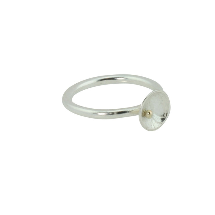 Eco silver cup ring with a 9ct gold ball. The silver ring band features a domed cup with a pebble texture.