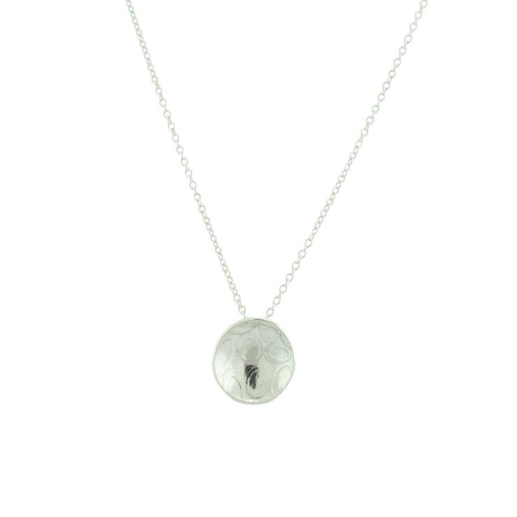 Eco silver pendant necklace with a pebble texture and mirror finish. 