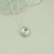 Eco silver pendant necklace with a stripe texture and mirror finish. 