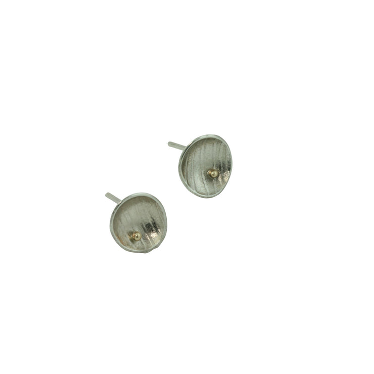 Eco silver domed cups with a stripe texture.  A 9ct gold ball sits a bit to the side at the bottom half of the cup. The earrings have a shiny finish.