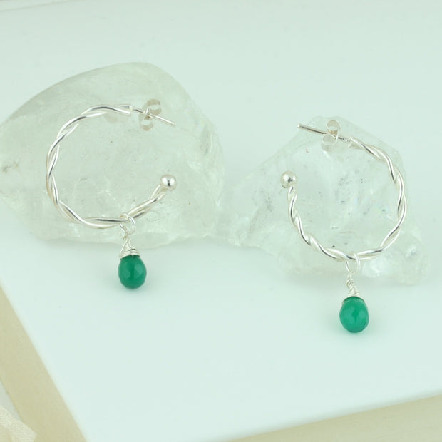 Silver hoop earrings featuring two twisted wires, with briolette gemstones. Classic hoop earrings, featuring a shiny polished finish. Shown here on combined with the Green Onyx briolette gemstones. Separate gemstones to add to your collection are available as well.