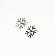 Silver snowflake earrings featuring a stud earring which can be worn on its own. The drop part can be added by looping the stud through the jump ring which features four chains, of which two have a snowflake attached at the bottom. One is larger than the other. The total length of the drop is 10cm / 4".