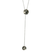 Silver y necklace featuring two split circles. They are domed circles split in half and soldered together with the domes pointing in opposite directions. The chain slides through the top split circle to adjust the length.