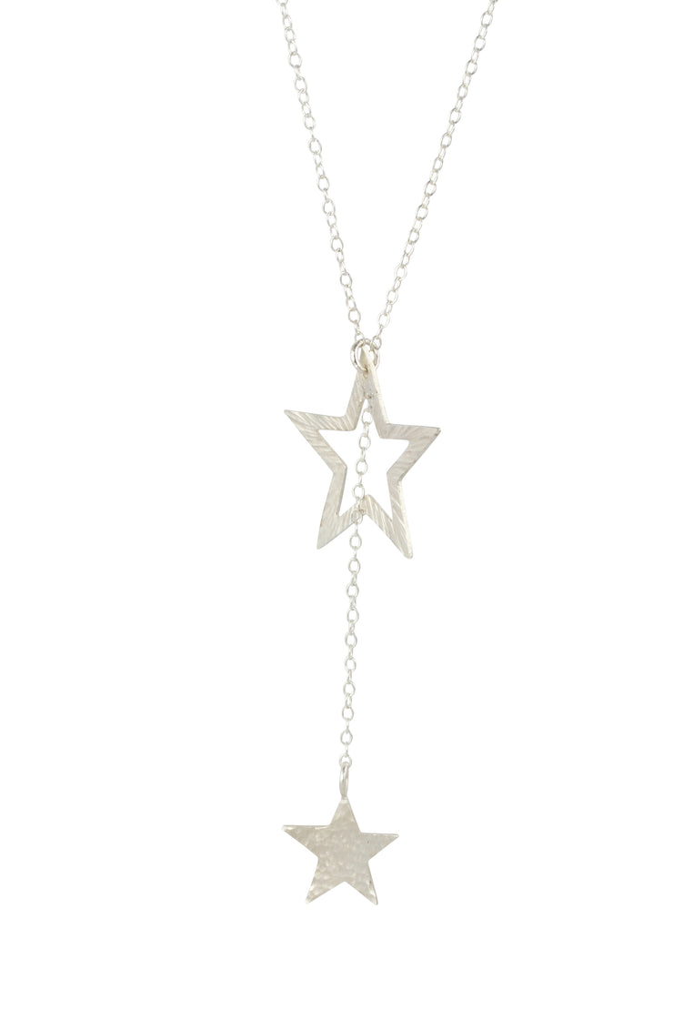 Silver necklace featuring a smaller stars on one end and a larger star on the other. The chain is looped through the larger star. Both stars have a textured finish, the larger star stripes and and the smaller star round dots.  Their backs have a mirror finish. By pulling the smaller star through the larger star you can adjust the length.