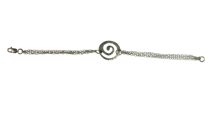 Silver chain bracelet with three chains and a silver swirl in the middle. The swirl has a striped hammered texture and a shiny finish.