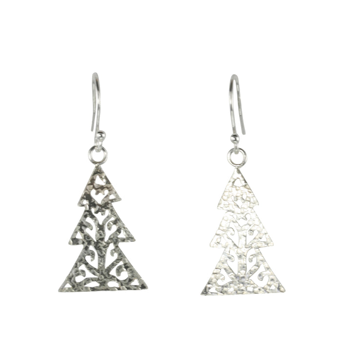 Silver hook earrings in the shape of a Christmas three with three layers. The trees feature a hand drawn pattern which is hand sawn with swirls from the centre to the sides. They have a hammered texture which has been polished to a shiny finish, giving them a shimmer effect. 